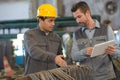 Two workers working in factory Royalty Free Stock Photo