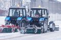 Two working snow cleaners.
