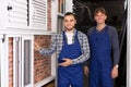 Two workmen inspecting windows Royalty Free Stock Photo