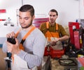 Two workmen toiling in workshop Royalty Free Stock Photo