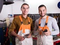 Two workmen toiling in workshop Royalty Free Stock Photo