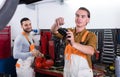 Two workmen toiling in workshop Royalty Free Stock Photo