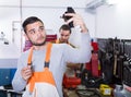 Two workmen toiling in workshop Royalty Free Stock Photo