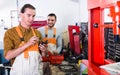 Two workmen toiling in workshop Royalty Free Stock Photo