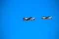 Two World War II era fighters re-enacting a dog fight Royalty Free Stock Photo