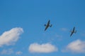 Two World War II era fighters re-enacting a dog fight Royalty Free Stock Photo