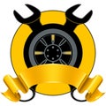 Two wrenches and tire on gold circle with banner Royalty Free Stock Photo