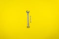 Two wrenches on a yellow background Royalty Free Stock Photo