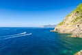 Two yachts boats sail on water of Ligurian and Mediterranean Sea near coastline of Riviera di Levante of National park Cinque Terr Royalty Free Stock Photo