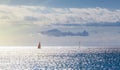 Two yachts sailing across the ocean in setting sun rays Royalty Free Stock Photo