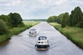 Two yachts sailing in a Dutch canal