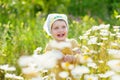 Two-year child at camomile meadow