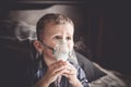 Two year old boy making inhalation with nebulizer at home Royalty Free Stock Photo