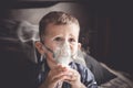 Two year old boy making inhalation with nebulizer at home Royalty Free Stock Photo