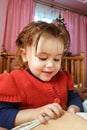 A two-year-old girl lies on the mother and drinks breast milk, the time of unity of mother and child