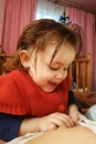 A two-year-old girl lies on the mother and drinks breast milk, the time of unity of mother and child