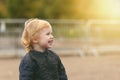 Two years boy is smiling looking to sunlight Royalty Free Stock Photo
