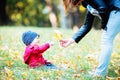 Two years old toddler have fun outdoor in autumn park Royalty Free Stock Photo