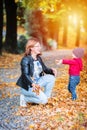 Two years old toddler have fun outdoor in autumn park Royalty Free Stock Photo