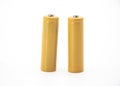 Two yellow AA size batteries isolated on white background Royalty Free Stock Photo