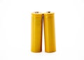 Two yellow AA size batteries isolated on white background Royalty Free Stock Photo