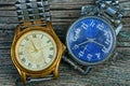 Two yellow and blue old shabby watch with a metal strap Royalty Free Stock Photo