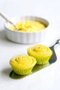 Two yellow cupcakes on cake shovel Royalty Free Stock Photo