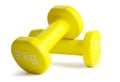 Two yellow dumbbells isolated on white background with clipping path