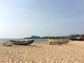 Two yellow fishing boats on empty beach Royalty Free Stock Photo