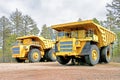 Two yellow dump trucks ready to work Royalty Free Stock Photo