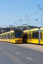 Two yellow modern Tramways in Budapest Royalty Free Stock Photo