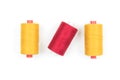 Yellow and red sewing thread coils on white background Royalty Free Stock Photo