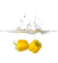Two Yellow Paprika Splash in Water