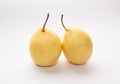 Two yellow pears on a light background Royalty Free Stock Photo