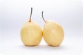 Two yellow pears on a light blue and white background Royalty Free Stock Photo