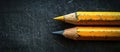 Two Yellow Pencils on Black Surface Royalty Free Stock Photo