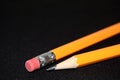 Two yellow Pencils on dark black blurred background. stationery. Office tool. Business concept. Royalty Free Stock Photo