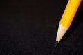 Two yellow Pencils on dark black blurred background. stationery. Office tool. Business concept. Royalty Free Stock Photo