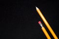 Two yellow Pencils on dark black blurred background. stationery. Office tool. Business concept. Royalty Free Stock Photo