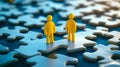 Two yellow people standing on top of a puzzle piece Royalty Free Stock Photo