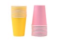 Two yellow and pink stacks of paper cups Royalty Free Stock Photo