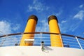 Two yellow pipes on big cruise ship. Royalty Free Stock Photo