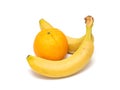 Two yellow ripe bananas and orange Royalty Free Stock Photo