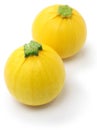 Two yellow round zucchini