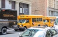 Two Yellow School Buses Parked in a Row in a Manhattan Neighborhood Royalty Free Stock Photo