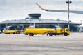 Two yellow tank truck aircraft refuelers