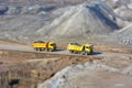 Two yellow trucks in a coal mine Royalty Free Stock Photo