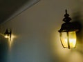 Two yellow wall sconce on the wall. Royalty Free Stock Photo