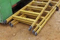 Two yellow wooden ladders