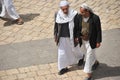 Two yemeny man walk on a Sanaa street in Yemen